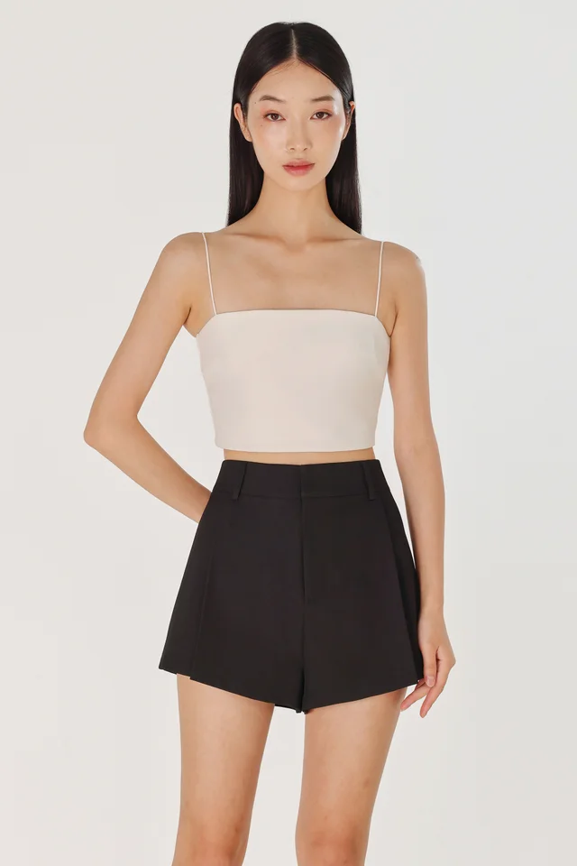 CAYLIN PLEATED FLARE SLANT HEM SHORTS (BLACK)