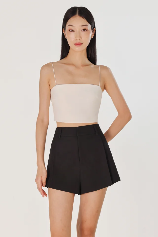 CAYLIN PLEATED FLARE SLANT HEM SHORTS (BLACK)