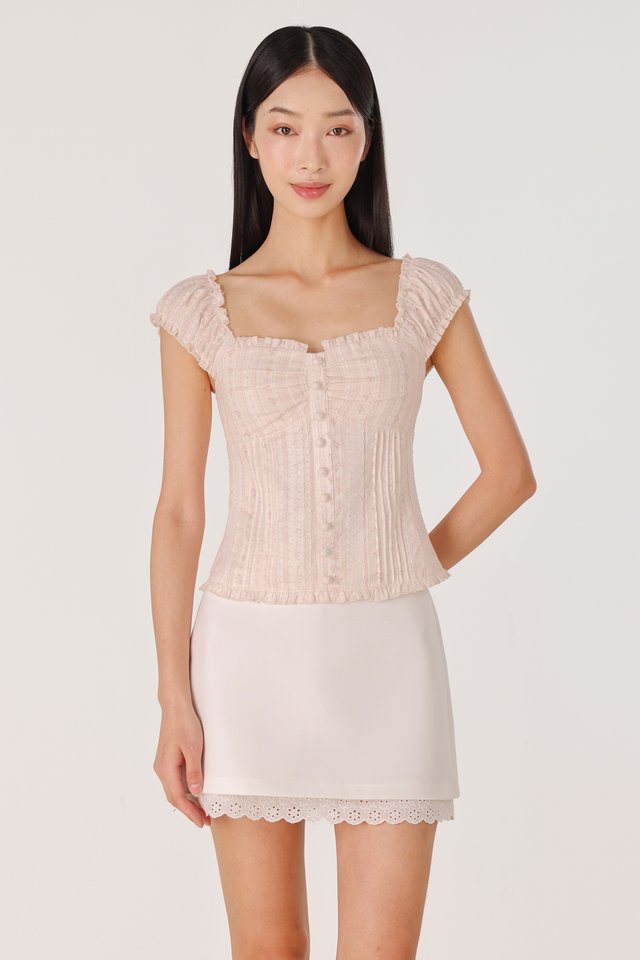 AVARA PADDED RUFFLE TRIM BUTTON TOP (OAT)