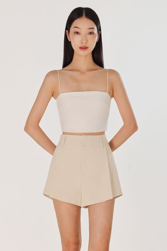 CAYLIN PLEATED FLARE SLANT HEM SHORTS (CLAY)