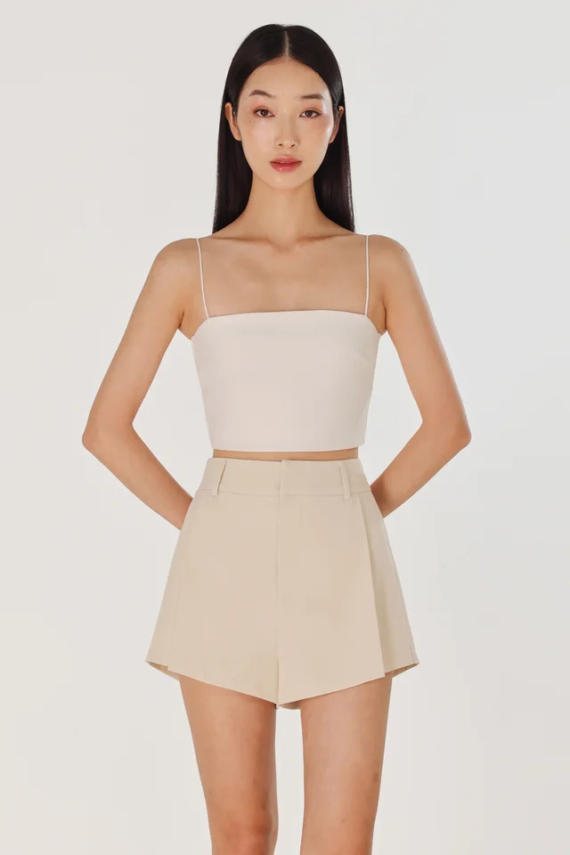 CAYLIN PLEATED FLARE SLANT HEM SHORTS (CLAY)