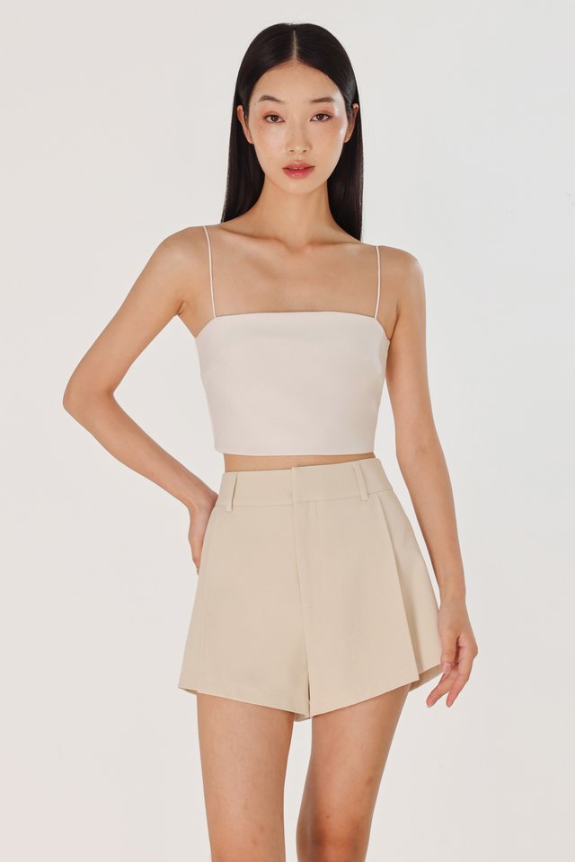 CAYLIN PLEATED FLARE SLANT HEM SHORTS (CLAY)