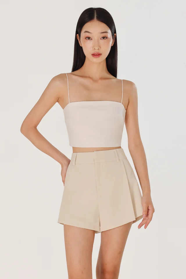 CAYLIN PLEATED FLARE SLANT HEM SHORTS (CLAY)