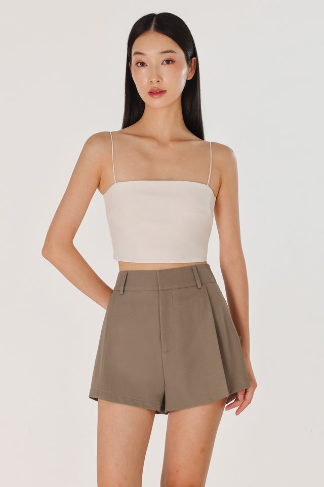 CAYLIN PLEATED FLARE SLANT HEM SHORTS (BROWN)